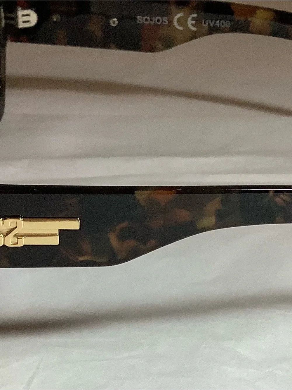 Geometric polarized square double bridge sunglasses by Sojo.